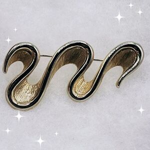 Vintage Monet ribbon wave brooch.